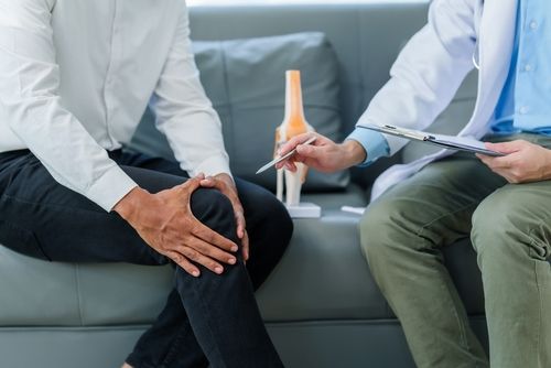 Chronic Joint Pain, Doctor Helping Patient With Knee Pain