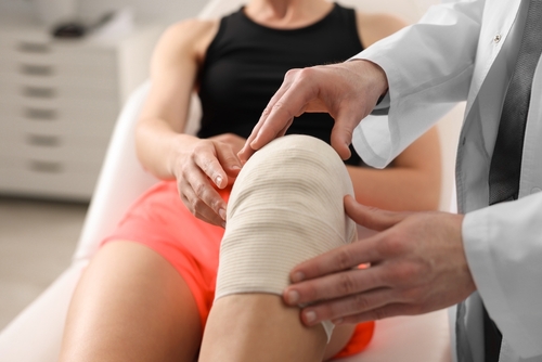 sports injury, Image depicting a patient undergoing treatment for overtraining syndrome at a sports medicine clinic, emphasizing the importance of medical care in recovery.